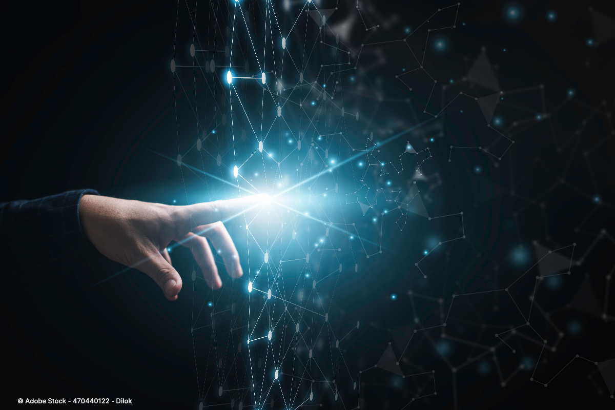 Eine Hand berührt ein leuchtendes digitales Netzwerk aus verbundenen Datenpunkten und veranschaulicht die Digitalisierung Definition moderner Technologien.
